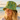 A smiling woman on a sandy beach wearing a green bucket hat with a detailed botanical and nautical print, paired with a white open-front shirt.