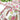 Decorative tablecloth with floral and vine design on a table.